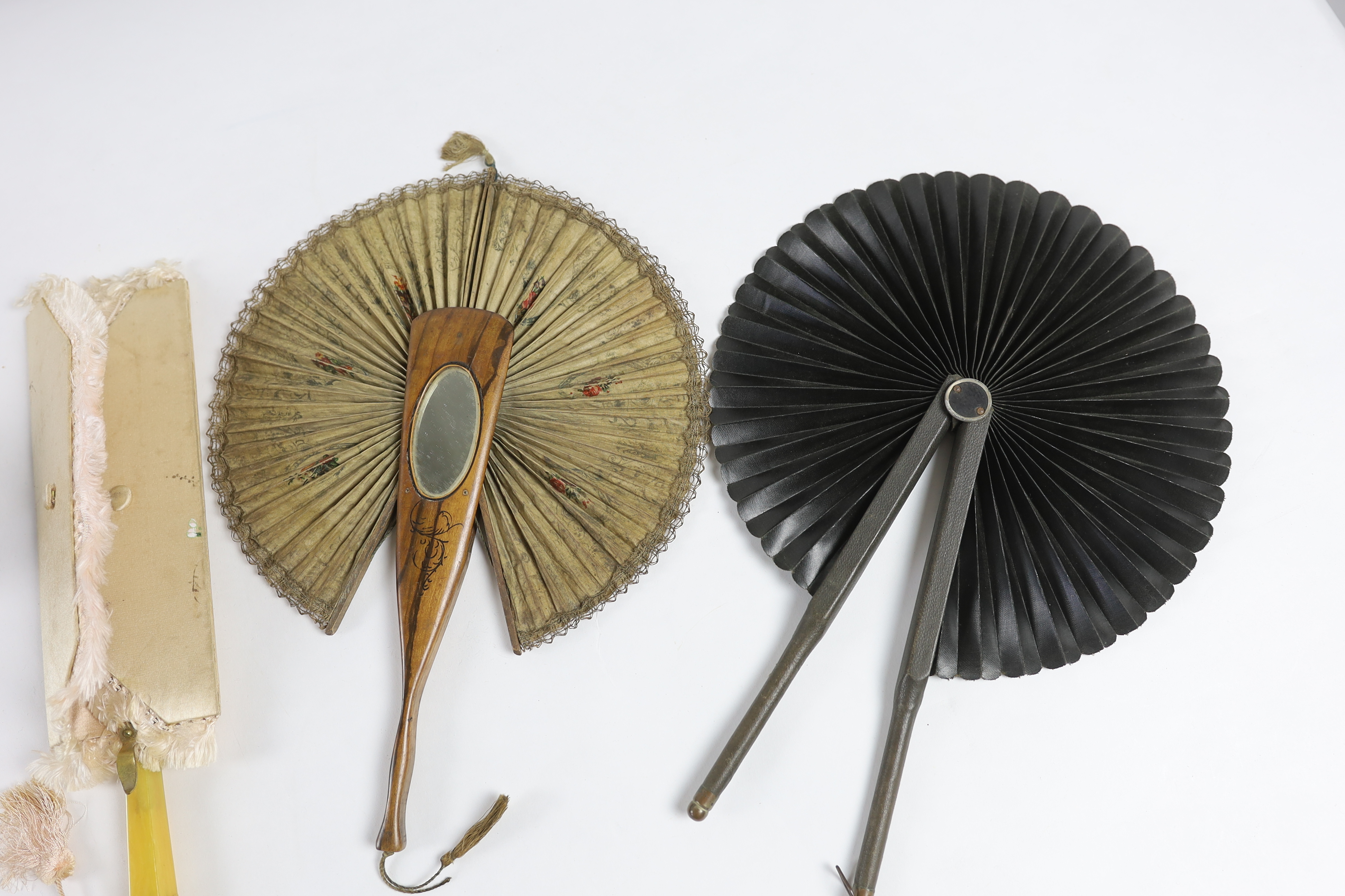 Six Edwardian novelty and unusual fans, some possibly bought during a Grand Tour.